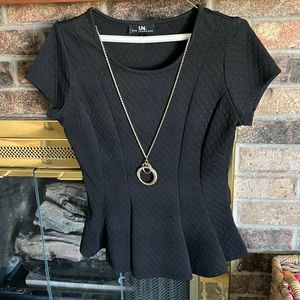 Black peplum top with attached statement necklace